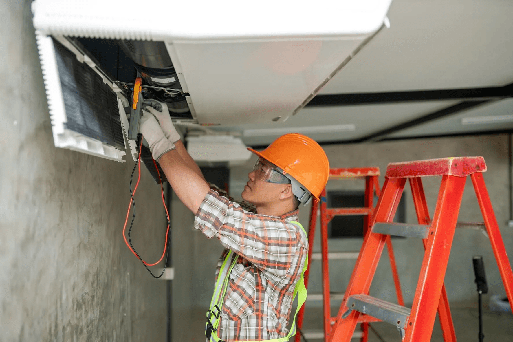 HVAC technician performing AC repair service in residential home